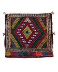 Colorful kilim rug with geometric pattern on a white background
