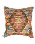 Multicolored patterned pillow on a white background