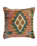Multicolored patterned pillow on a white background