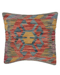Multicolored patterned pillow on a white background