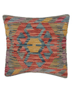Multicolored patterned pillow on a white background
