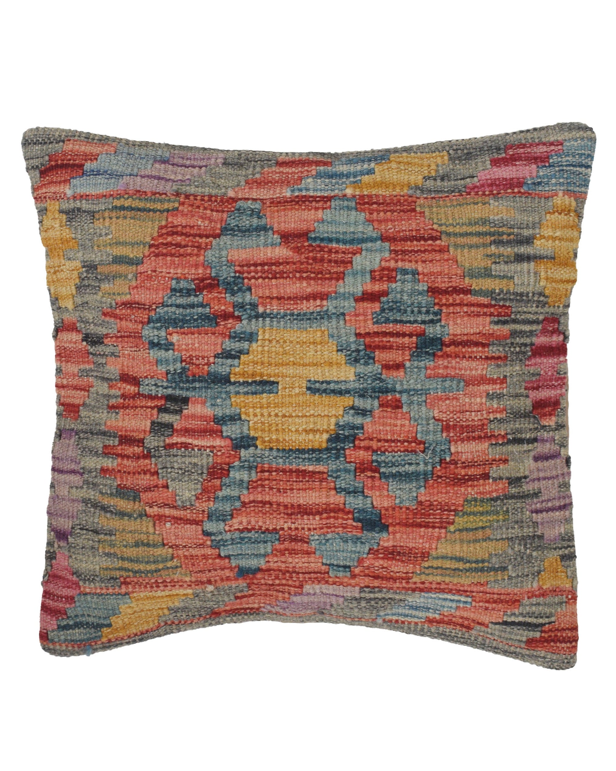 Multicolored patterned pillow on a white background
