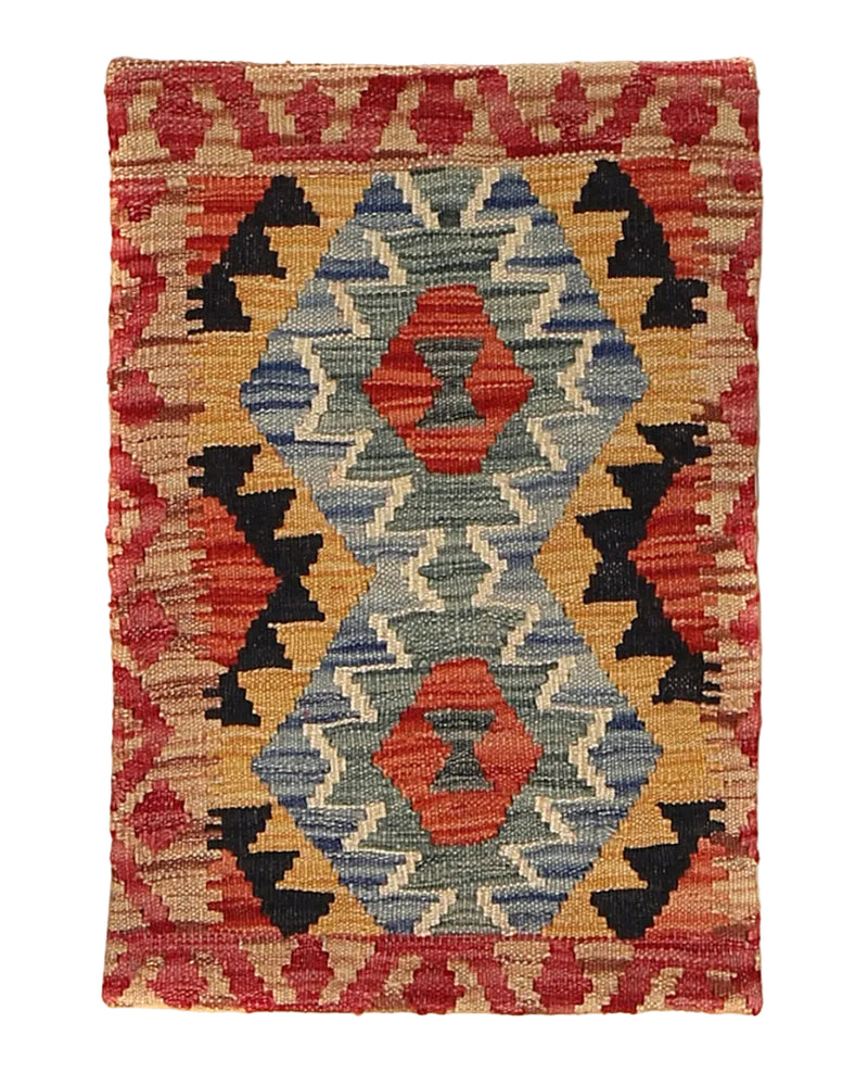 Colorful kilim rug with geometric pattern on a white background