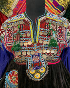 Colorful embroidered garment with intricate patterns and designs.