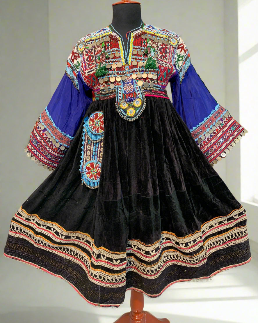 Traditional embroidered garment with intricate patterns on a textured surface