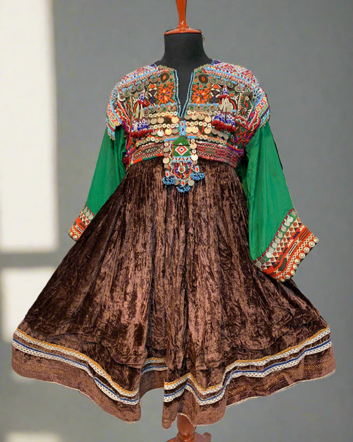 Traditional embroidered dress with colorful patterns on a textured surface