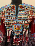 Kuchi Ethnic Dress In Shiny Purple Fabric