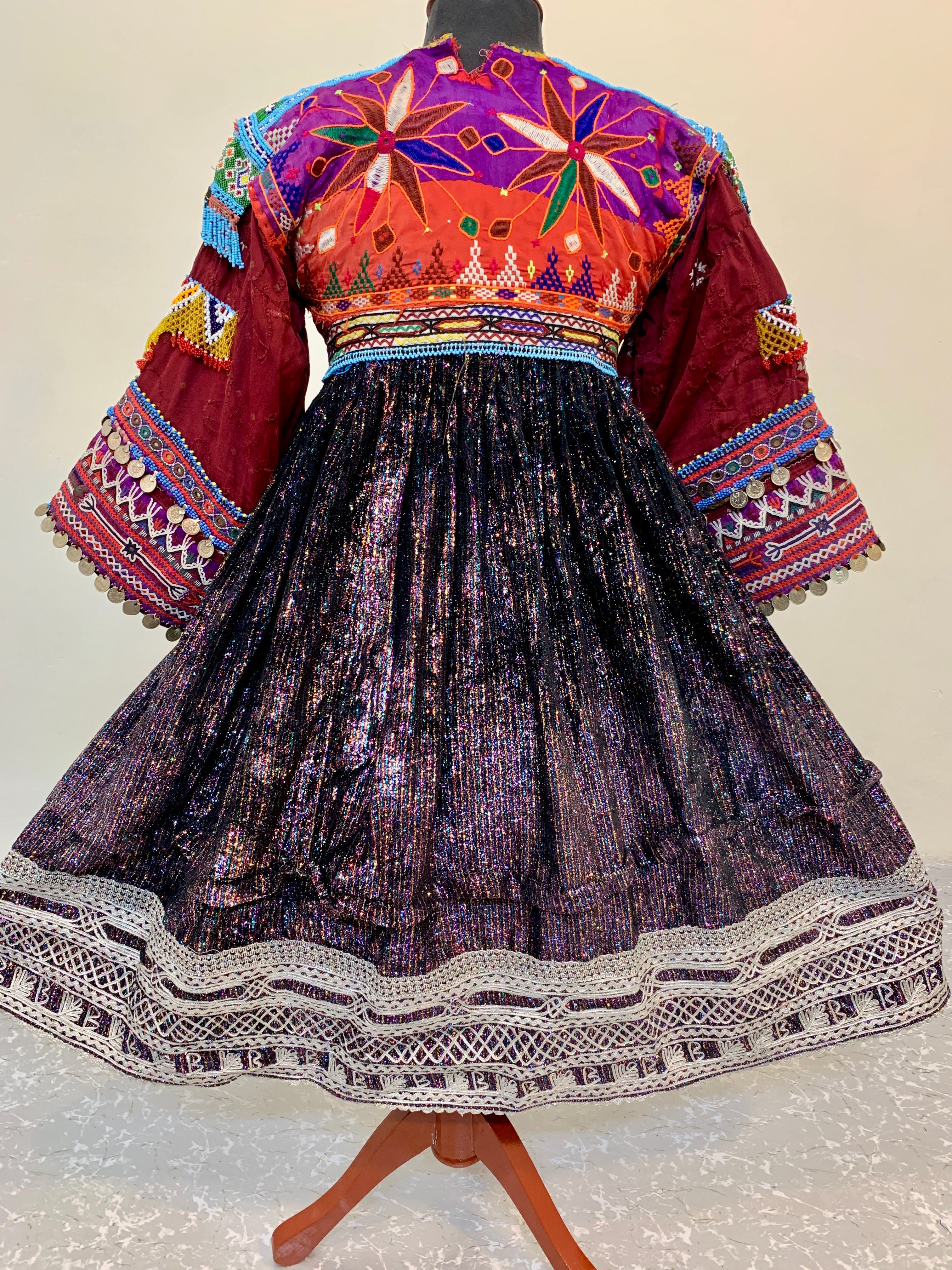 Kuchi Ethnic Dress In Shiny Purple Fabric