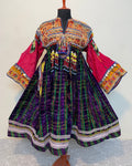 Colorful traditional dress with intricate patterns on a white background