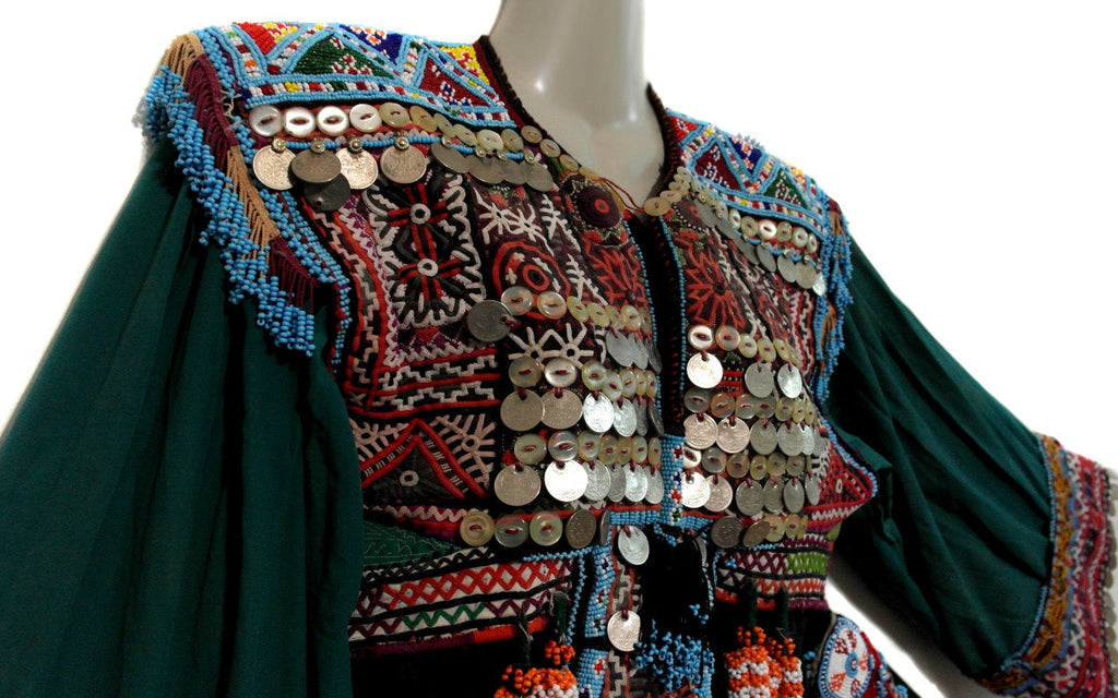 tribal fashion kuchi dress with lot of coins and beads work