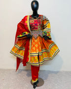 Colorful traditional outfit on a mannequin against a white background