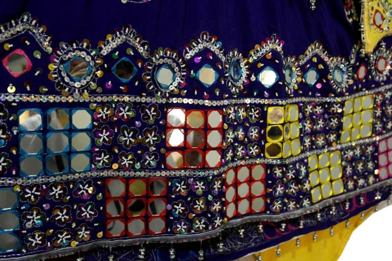 hand work mirrors on a dress in afghan wedding dance