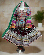 Colorful traditional dress on a mannequin with a vibrant background of various garments.
