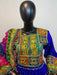 Colorful embroidered fabric on a mannequin against a white background