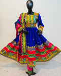 Colorful traditional dress on a mannequin against a plain background