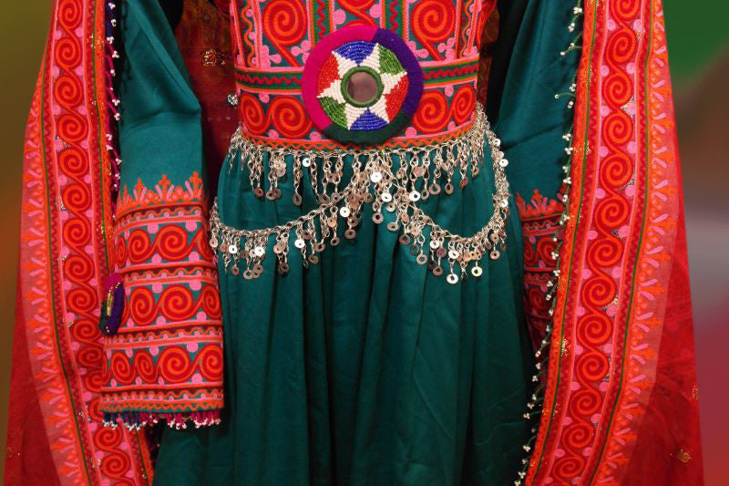 teal color afghan dress with chains medallions