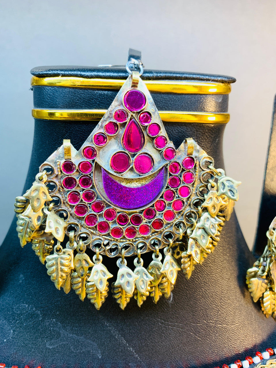 afghan tribal style tiki pendant with pink stones