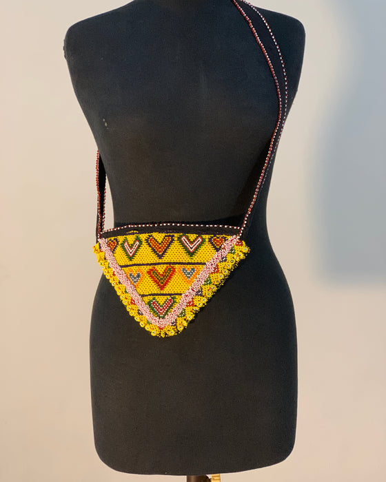 Black saddle pad with a colorful geometric pattern on a neutral background