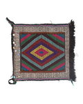 Colorful kilim rug with geometric pattern on a white background