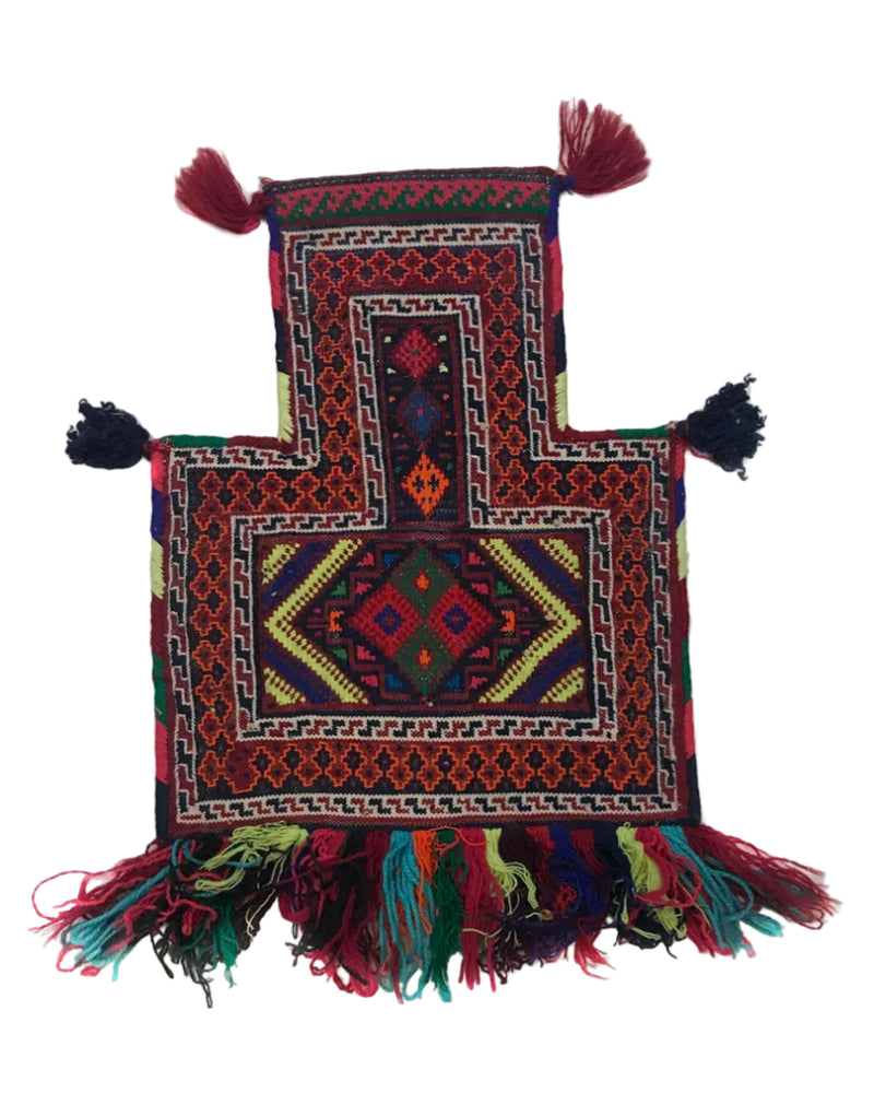 Colorful patterned rug with tassels on a white background